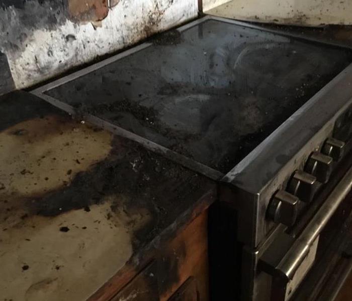 A stove after a homeowner forgot about food cooking.